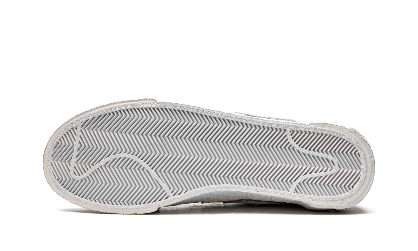 Blazer Low "Sacai - White Patent Leather" DM6443 100